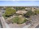 Aerial of community green space with landscaping and walking trails at 14369 W Wethersfield Rd, Surprise, AZ 85379