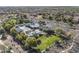 An aerial view of community pool, clubhouse, parking, and landscaping at 14369 W Wethersfield Rd, Surprise, AZ 85379