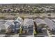 An aerial view showcasing a neighborhood with solar panels on the roofs of the homes at 14369 W Wethersfield Rd, Surprise, AZ 85379