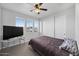 Bedroom with closet, carpet flooring, and windows providing natural light at 14369 W Wethersfield Rd, Surprise, AZ 85379