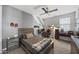 Bedroom with a ceiling fan, desk space, sports themed decor, and neutral carpet at 14369 W Wethersfield Rd, Surprise, AZ 85379