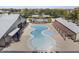 An aerial view of the community pool area that features ample seating and pergola-covered spots at 14369 W Wethersfield Rd, Surprise, AZ 85379