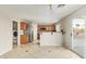 Kitchen features stainless steel appliances and wood cabinetry, open to the dining area at 15118 W Lincoln St St, Goodyear, AZ 85338