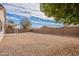 Large backyard with gravel and covered patio at 15145 W Elko Dr, Surprise, AZ 85374