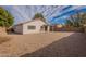 Backyard view of house with gravel and patio at 15145 W Elko Dr, Surprise, AZ 85374