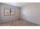 Simple bedroom with neutral walls and carpeted floor at 15145 W Elko Dr, Surprise, AZ 85374