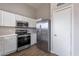 Modern kitchen with stainless steel appliances and white cabinets at 15145 W Elko Dr, Surprise, AZ 85374