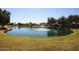 Picturesque community pond with a fountain and lush green surroundings at 15145 W Elko Dr, Surprise, AZ 85374