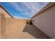 Side yard with gravel and block wall at 15145 W Elko Dr, Surprise, AZ 85374