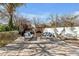 Inviting backyard featuring a stone fireplace, comfortable seating, and a peaceful setting at 1560 W Augusta Ave, Phoenix, AZ 85021