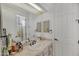 Bathroom with a vanity, decorative mirror, and ample lighting at 1560 W Augusta Ave, Phoenix, AZ 85021