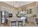 Modern kitchen with stainless steel appliances, white cabinets, and quartz countertops at 1560 W Augusta Ave, Phoenix, AZ 85021