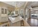 Bright kitchen with white cabinetry, large center island, and modern pendant lighting at 1560 W Augusta Ave, Phoenix, AZ 85021