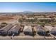 Aerial view of neighborhood showcasing houses and distant mountains at 1631 E Paul Dr, Casa Grande, AZ 85122