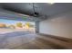 Spacious garage with automatic opener and view of the street at 1631 E Paul Dr, Casa Grande, AZ 85122