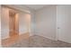 A light-filled hallway with wood-look tile flooring and neutral walls at 1631 E Paul Dr, Casa Grande, AZ 85122