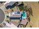 Birds eye view of a private backyard featuring a pool, patio and artificial turf at 16934 N 158Th Ave, Surprise, AZ 85374