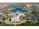 Aerial view of a community center featuring a pond, library, and open spaces at 16934 N 158Th Ave, Surprise, AZ 85374