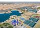 Aerial view of a recreation area including a lake, tennis courts, and playground at 16934 N 158Th Ave, Surprise, AZ 85374