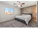 Cozy bedroom with carpet flooring, wood paneling, and a ceiling fan at 16934 N 158Th Ave, Surprise, AZ 85374