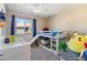 Bright bedroom featuring a bunk bed, comfortable carpet, and natural light from the window at 16934 N 158Th Ave, Surprise, AZ 85374