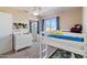 Bedroom featuring a bunk bed, carpet flooring, and natural light from the window at 16934 N 158Th Ave, Surprise, AZ 85374