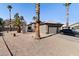 Single-story home with low maintenance front yard landscaping, featuring a spacious driveway at 16934 N 158Th Ave, Surprise, AZ 85374