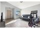 Bright living room with a large picture window, light gray walls and tile floors at 16934 N 158Th Ave, Surprise, AZ 85374