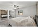 Bright main bedroom featuring a mirrored closet and plush carpet flooring at 16934 N 158Th Ave, Surprise, AZ 85374