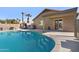 Beautiful backyard pool with deck and view of the home exterior at 16934 N 158Th Ave, Surprise, AZ 85374