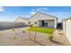 Landscaped backyard with artificial turf at 17747 W Mission Ln, Waddell, AZ 85355