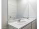 Double sink bathroom vanity with marble countertop at 17747 W Mission Ln, Waddell, AZ 85355