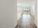 Bright hallway with wood-look flooring leading to the living room at 17747 W Mission Ln, Waddell, AZ 85355