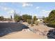 Landscaped backyard with gravel, stone features, and cacti at 17831 N 130Th Ave, Sun City West, AZ 85375