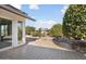 Backyard patio with tile flooring, desert landscaping, and citrus trees at 17831 N 130Th Ave, Sun City West, AZ 85375