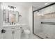 Modern bathroom with white vanity, shower, and hexagon tile at 17831 N 130Th Ave, Sun City West, AZ 85375