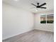 Spacious bedroom with a large window and ceiling fan at 17831 N 130Th Ave, Sun City West, AZ 85375