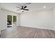 Spacious bedroom with sliding glass doors and a ceiling fan at 17831 N 130Th Ave, Sun City West, AZ 85375