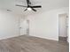 Bright bedroom with ceiling fan and wood-look floors at 17831 N 130Th Ave, Sun City West, AZ 85375