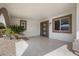 Covered entry with tile flooring and modern front door at 17831 N 130Th Ave, Sun City West, AZ 85375