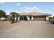 Single story home with a two-car garage and desert landscaping at 17831 N 130Th Ave, Sun City West, AZ 85375