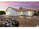 Back of house showing patio, landscaping, and desert plants at 17831 N 130Th Ave, Sun City West, AZ 85375