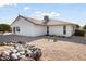 Back of house showing patio, landscaping, and desert plants at 17831 N 130Th Ave, Sun City West, AZ 85375