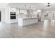 Newly renovated kitchen featuring white cabinets, a large island, and stainless steel appliances at 17831 N 130Th Ave, Sun City West, AZ 85375