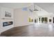 Bright living room featuring vaulted ceiling and fireplace at 17831 N 130Th Ave, Sun City West, AZ 85375