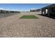 Landscaped backyard with artificial turf and gravel at 18242 W Colter St, Litchfield Park, AZ 85340