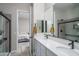 Double vanity bathroom with modern fixtures and a shower at 18242 W Colter St, Litchfield Park, AZ 85340