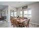 Casual dining area with wooden table and access to backyard at 18242 W Colter St, Litchfield Park, AZ 85340