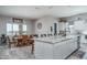 Eat-in kitchen with island seating and adjacent dining area at 18242 W Colter St, Litchfield Park, AZ 85340