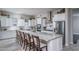 Island kitchen with white cabinets and granite countertops at 18242 W Colter St, Litchfield Park, AZ 85340